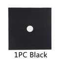 Black square rubber lens cap with central circular hole for camera or projector